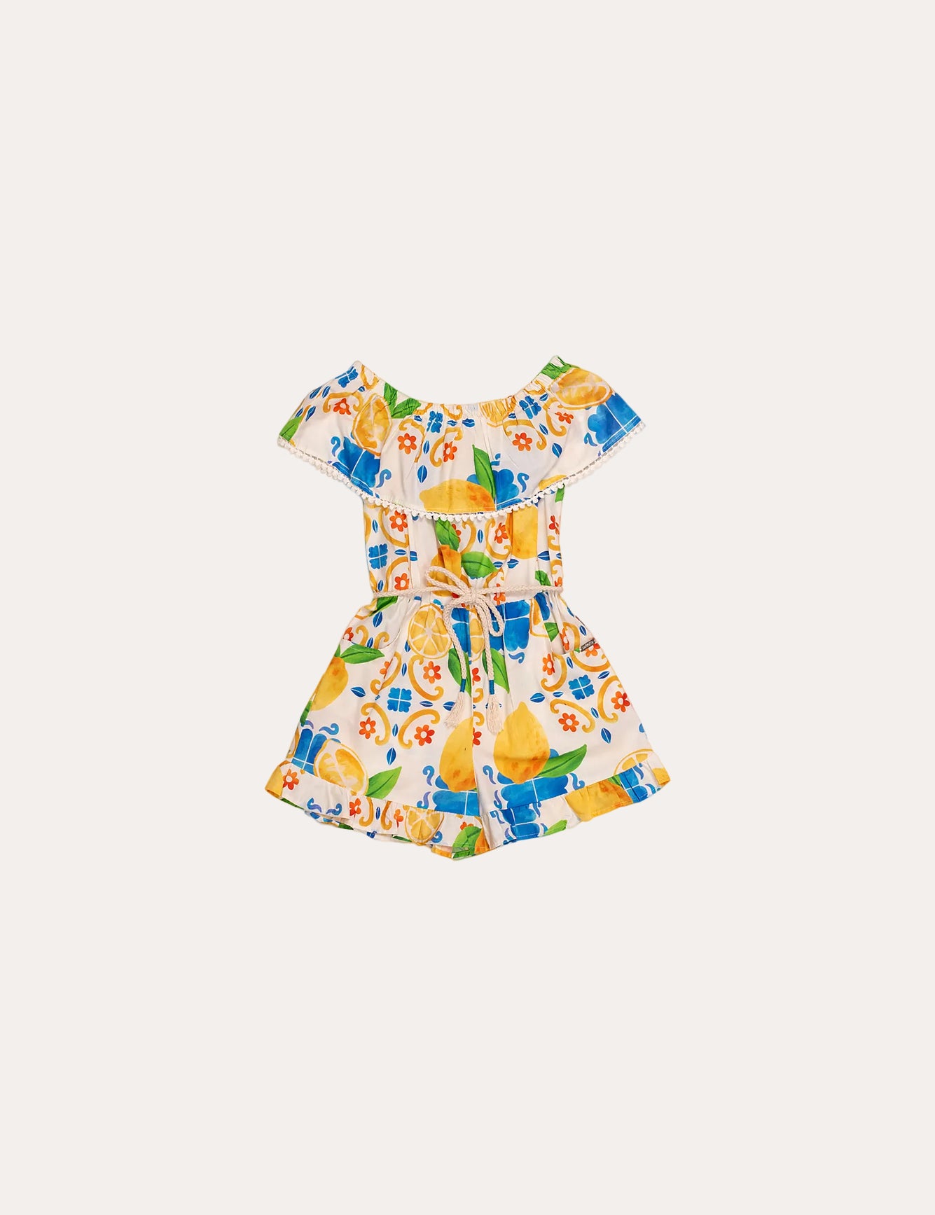 Macacao feminino infantil com estampa de limões e flores em azul e amarelo