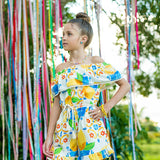 Macacao feminino infantil com estampa de limões e flores em azul e amarelo