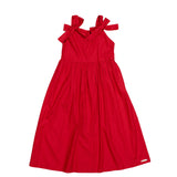 Vestido midi feminino infantil com alças largas e laços, saia ampla e tecido macio.