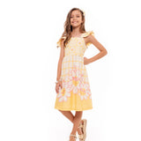 Vestido infantil amarelo com estampa floral e alças largas, detalhe em babados na barra