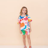 Conjunto infantil feminino com blusa de mangas amplas e shorts, estampa geométrica colorida