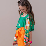 Short feminino infantil com cintura alta e detalhe de laço, peça lúdica e confortável