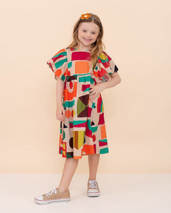 Vestido infantil com estampa geométrica colorida e mangas bufantes, ideal para meninas.