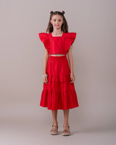 Conjunto infantil feminino com blusa de babados e saia volumosa em camadas