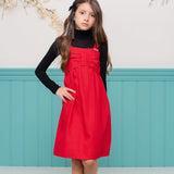 Vestido curto vermelho com alças largas e caimento leve, ideal para meninas.