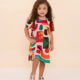 Vestido infantil com estampa geométrica colorida e mangas curtas, ideal para meninas de 0 a 3 anos