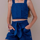 Conjunto infantil feminino azul escuro com blusa de alças largas e saia com cintura elástica