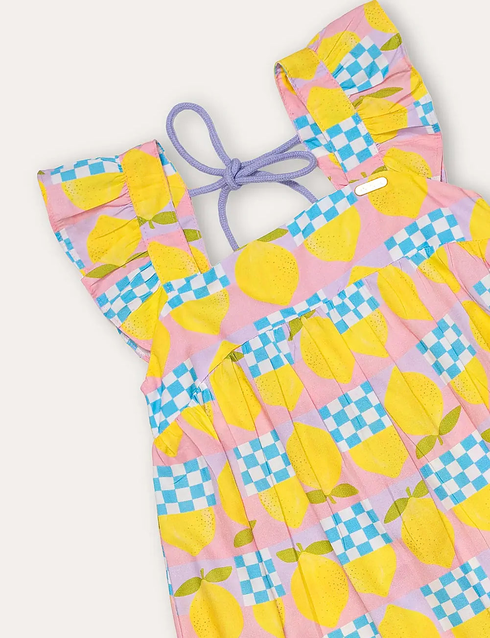 Vestido infantil amarelo com estampa de círculos e quadrados coloridos, alças largas e saia rodada