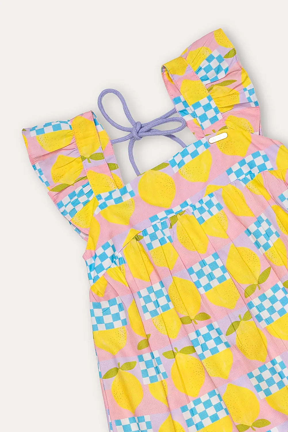 Vestido infantil amarelo com estampa de círculos e quadrados coloridos, alças largas e saia rodada