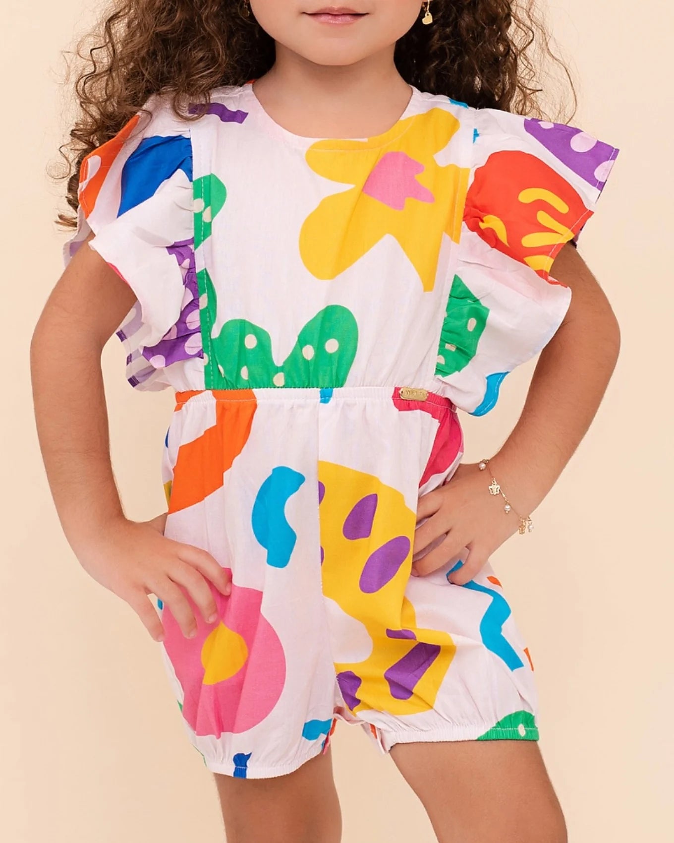 Romper infantil feminino com estampa colorida de formas geométricas e mangas bufantes