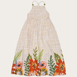 Vestido longo feminino infantil com estampa floral colorida e fundo xadrez