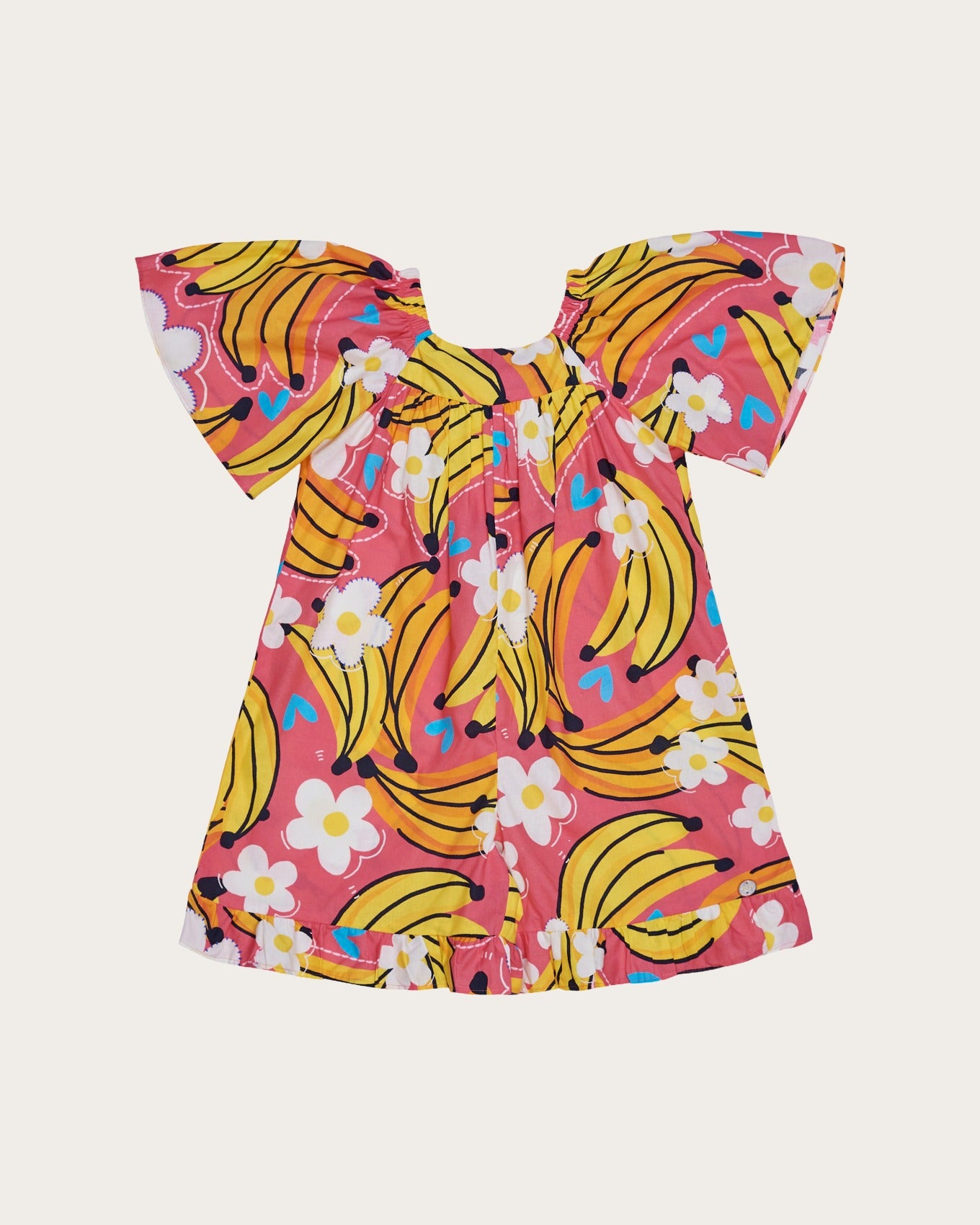 Macaco feminino infantil com estampa de bananas e flores em fundo rosa, detalhe de mangas amplas