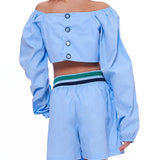 Conjunto feminino infantil azul claro com cropped de mangas longas e short prático