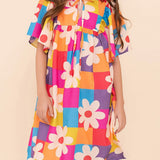 Vestido infantil com estampa floral colorida e mangas bufantes, ideal para meninas