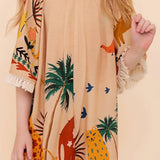 Macaco infantil com estampa de safári, mangas bufantes e caimento solto