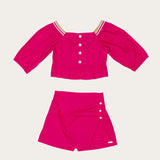 Conjunto rosa infantil feminino com blusa de mangas longas e short com babados