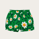 Conjunto infantil feminino com blusa verde e short, estampa de flores brancas e detalhe em renda