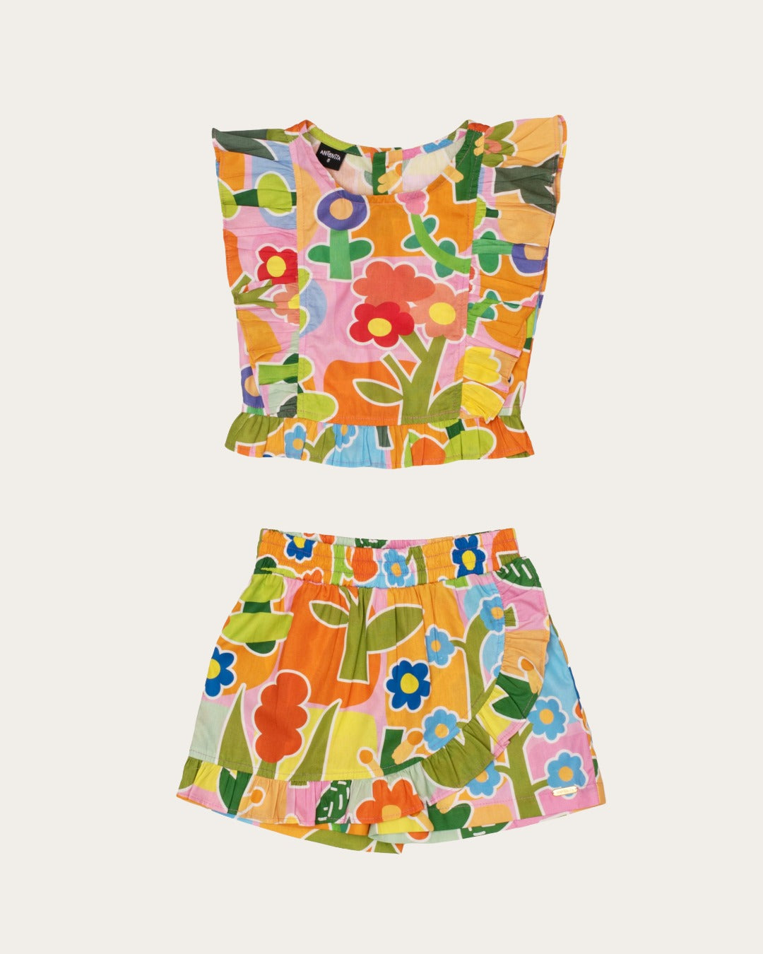 Conjunto infantil feminino com blusa de alças largas e saia estampada com flores coloridas