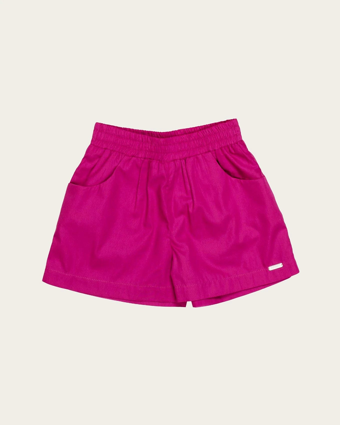 Conjunto infantil feminino com blusa tropical e short rosa, estampa de flores e folhas