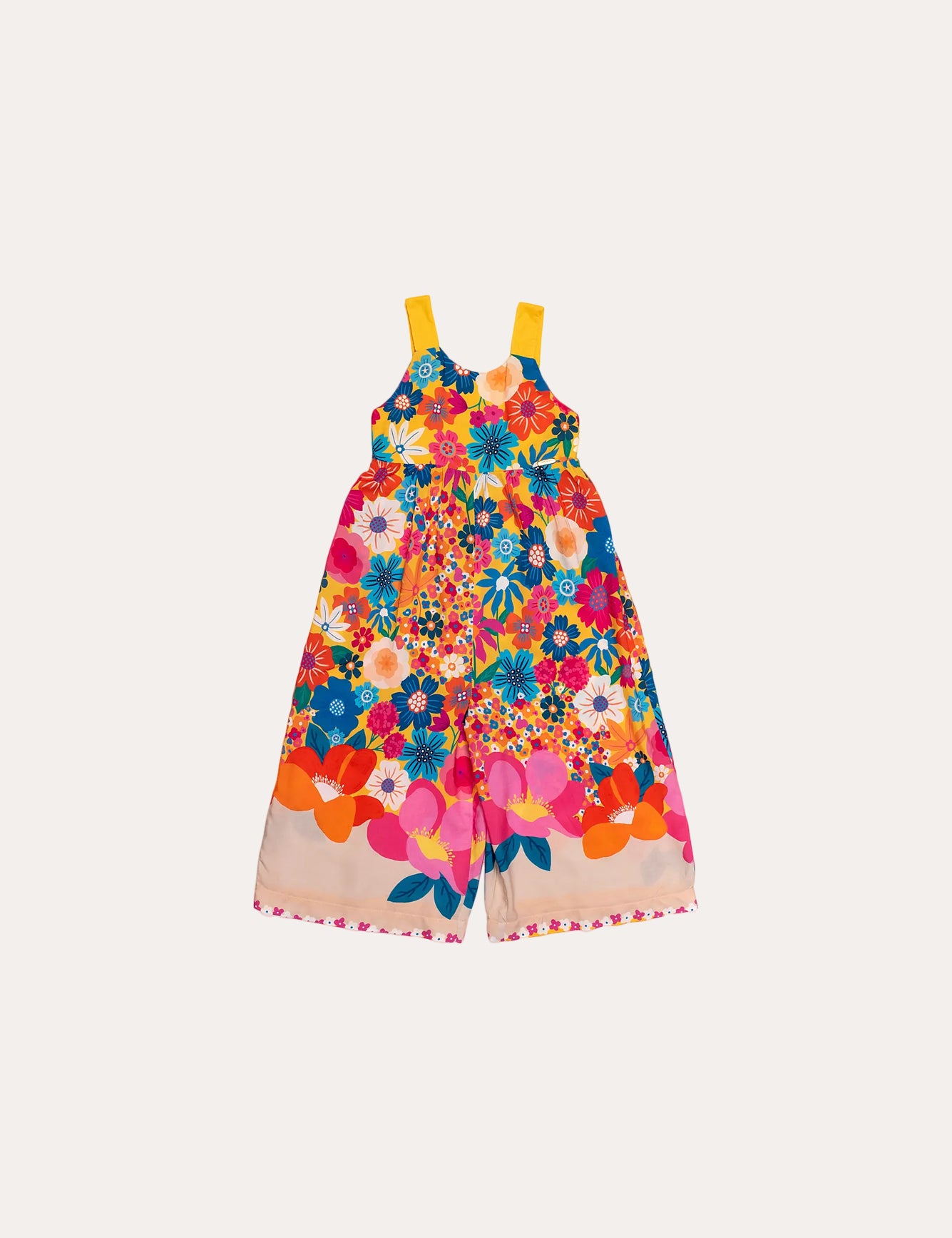 Macacão floral colorido com flores em tons vibrantes e alças largas, feminino infantil