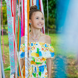 Macacao feminino infantil com estampa de limões e flores em azul e amarelo