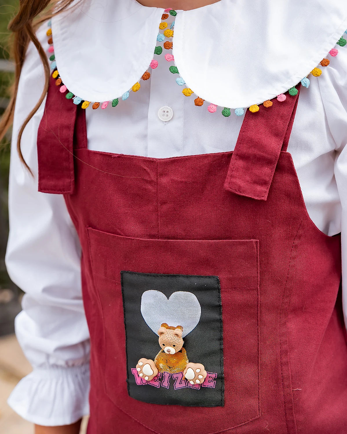 Macacão em tom vinho com detalhe lúdico infantil feminino Antonita para meninas 