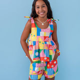 Conjunto infantil feminino com blusa de alças largas e short, estampa geométrica colorida