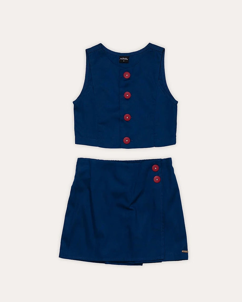 Conjunto infantil feminino azul escuro com blusa de alças largas e saia, detalhes em botões