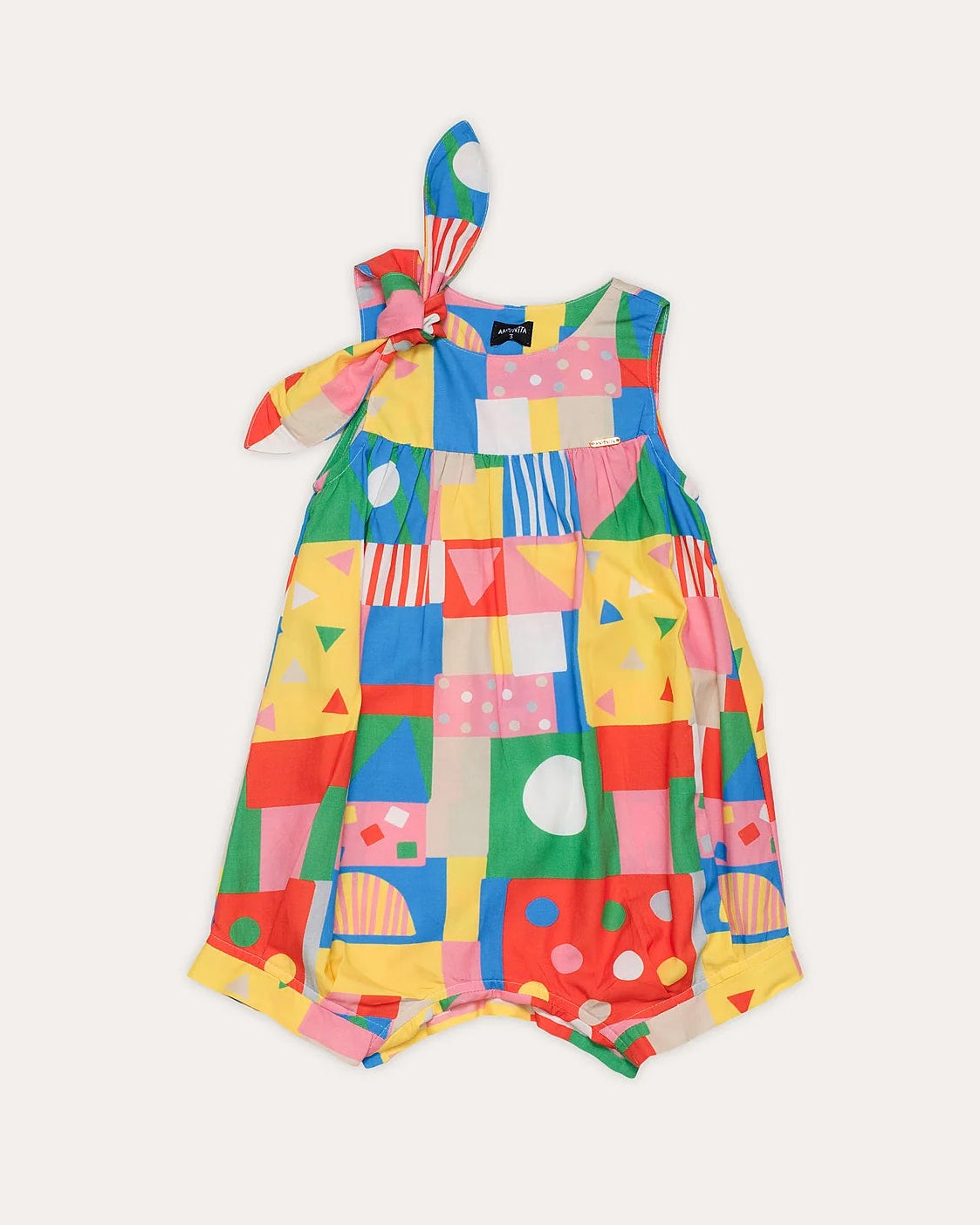 Macacão infantil feminino colorido com estampa geométrica e alças com laço