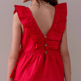 Conjunto infantil feminino com blusa de alças largas e shorts, detalhe de babados