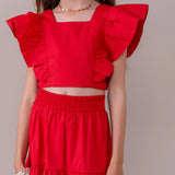 Conjunto infantil feminino com blusa de babados e saia volumosa em camadas