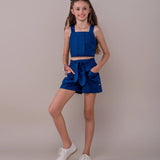 Conjunto infantil feminino azul escuro com blusa de alças largas e saia com cintura elástica