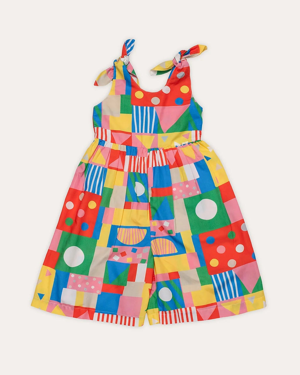 Macacão infantil feminino com estampa geométrica colorida e alças amarradas