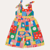 Macacão infantil feminino com estampa geométrica colorida e alças amarradas